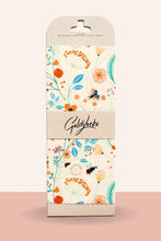 Load image into Gallery viewer, Packaging of Goldylocks food wrap with floral design on a beige background
